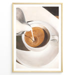 Ladda upp bild till gallerivisning, Coffee art print plakat showing milk being poured into a cup of espresso, creating a swirl pattern in a white cup on a saucer.
