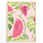 Ladda upp bild till gallerivisning, Watercolor poster featuring watermelon slices and tropical green leaves on a soft pink background, framed in golden.
