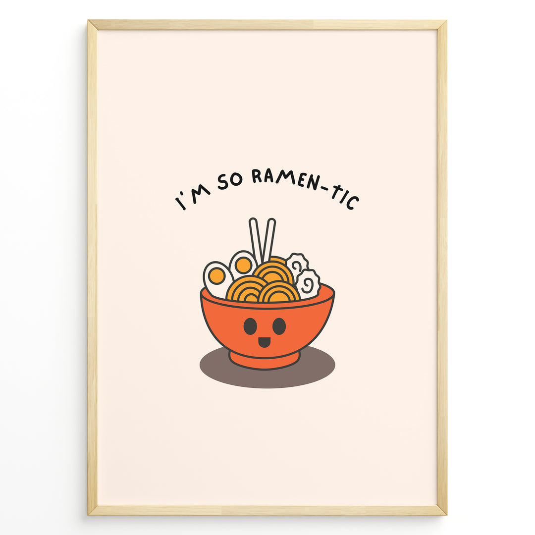 Cute ramen-themed poster with a smiling orange ramen bowl, chopsticks, and text “I’m So Ramen-tic,” framed in black on a light beige background.