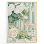 Ladda upp bild till gallerivisning, Elegant art print plakat of white wine glass, grapes, cheese, and hydrangeas on a green striped table with a hand holding a wine glass in a golden frame.
