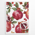 Ladda upp bild till gallerivisning, Vibrant pomegranate poster with red pomegranates, open fruits showing seeds, and green leaves on a white background, framed in black for modern kitchen or dining wall décor.
