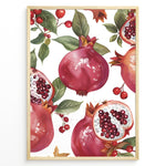 Ladda upp bild till gallerivisning, Vibrant pomegranate poster with red pomegranates, open fruits showing seeds, and green leaves on a white background, framed in black for modern kitchen or dining wall décor.
