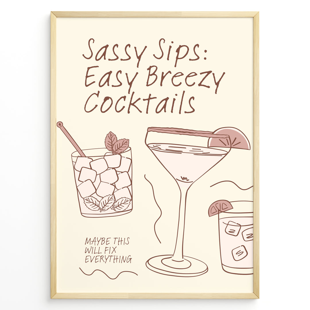 Minimalist cocktail-themed wall art with line drawings of martini and mojito glasses and the text “Sassy Sips: Easy Breezy Cocktails,” framed in black for kitchen or bar décor.