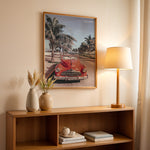 Ladda upp bild till gallerivisning, Plakat med vintage rød bil | Sommer og Strand Plakater | Denne plakat viser en klassisk rød cabriolet parkeret på en gade med palmer ved stranden. Perfekt til retro- og strandelskere.
