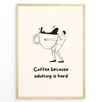 Ladda upp bild till gallerivisning, Funny minimalist wall art showing a person hugging a giant coffee cup with the quote “Coffee because adulting is hard,” ideal for kitchen, café, or office wall decoration.

