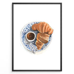 Ladda upp bild till gallerivisning, Watercolor wall art of a croissant and espresso cup on a blue decorative plate, ideal for French café, kitchen, or breakfast nook wall décor.
