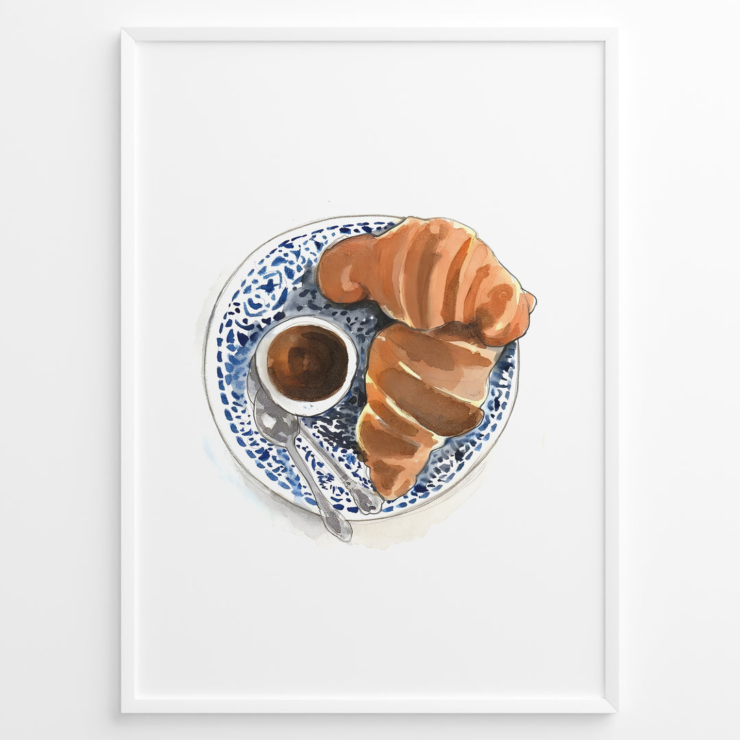 Watercolor wall art of a croissant and espresso cup on a blue decorative plate, ideal for French café, kitchen, or breakfast nook wall décor.