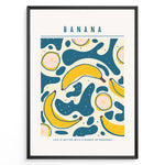Ladda upp bild till gallerivisning, Colorful banana art print plakat with abstract teal and yellow shapes, text reading “Life is better with a bunch of bananas,” framed in black.
