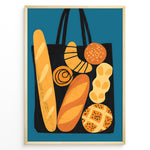 Ladda upp bild till gallerivisning, Modern art print of a tote bag filled with bread and pastries on a blue background — bakery-inspired kitchen wall décor.
