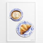 Ladda upp bild till gallerivisning, Art print of a cappuccino and croissant on blue patterned plates — French café-style kitchen wall décor.
