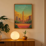 Ladda upp bild till gallerivisning, Buenos Aires Vintage Travel Plakat | Vintage Travel Poster | Denne plakat viser en illustration af et monument i Buenos Aires omgivet af moderne bygninger. Farverne går fra turkis til orange og gul, som skaber en livlig atmosfære.
