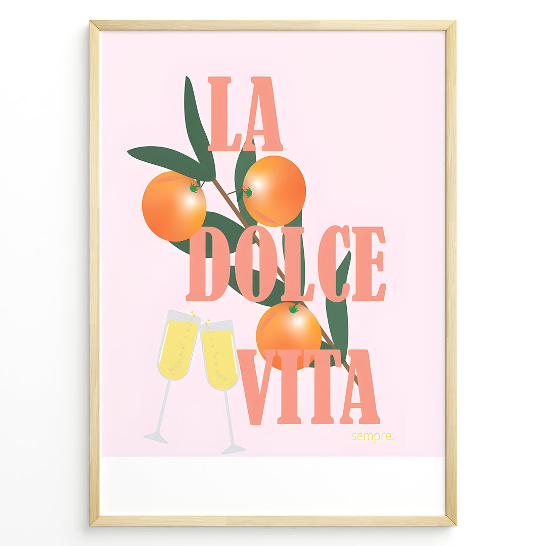 Stylish La Dolce Vita poster with oranges, green leaves, and champagne glasses on a pink background, framed as Italian-inspired wall art.