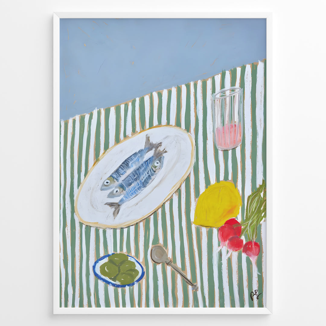 Mediterranean still life poster with fish on a white plate, lemon, radishes, olives, and a pink drink on a green and white striped tablecloth, framed as kitchen wall art.