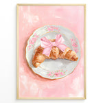 Ladda upp bild till gallerivisning, Illustrated croissant with a pink bow on a floral plate over a pink background.
