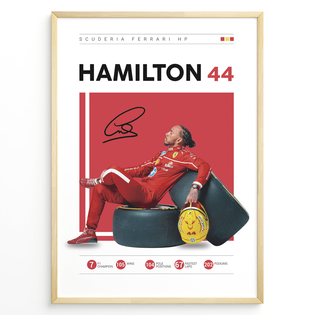 Framed Hamilton 44 Scuderia Ferrari F1 poster showing the driver in a red suit leaning on tires, holding a yellow helmet, with signature and career stats.