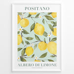 Ladda upp bild till gallerivisning, Positano lemon tree poster with yellow lemons, green leaves, and white flowers on a light blue background in a white frame.
