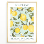 Ladda upp bild till gallerivisning, Positano lemon tree poster with yellow lemons, green leaves, and white flowers on a light blue background in a golden frame.
