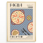 Ladda upp bild till gallerivisning, Vintage Spanish paella poster with illustrated pan of rice, prawns, and lemon slices on a blue patterned background in a gold frame.
