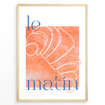 Ladda upp bild till gallerivisning, Le Matin poster with minimalist croissant illustration in orange and blue text on a white background in a golden frame.

