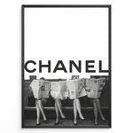 Ladda upp bild till gallerivisning, Fashion Plakat | CHANEL Newspaper Bench – Fashion Art Poster Plakaty.dk | Black and white fashion poster of four women sitting on a bench reading newspapers, with the bold text &quot;CHANEL&quot; across the top half of the image.
