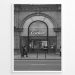Ladda upp bild till gallerivisning, Fashion Plakat | Cartier Boutique Street View – Black &amp; White Luxury Fashion Poster Plakaty.dk | Black and white photograph of a Cartier boutique storefront with a grand arched entrance and pedestrians walking by on a city street.
