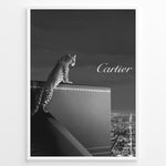 Ladda upp bild till gallerivisning, Fashion Plakat | Cartier Panther Over the City: Iconic Elegance in Monochrome Plakaty.dk | Black and white image of a panther perched on a Cartier box overlooking a city skyline at night, with the Cartier logo in the sky.
