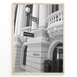 Ladda upp bild till gallerivisning, Fashion Plakat | Chanel Boutique Exterior – Monte Carlo, Monaco Plakaty.dk | Black and white photo of the Chanel storefront in Monte Carlo, Monaco, showcasing ornate architecture with columns, balconies, and a hanging sign.
