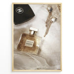 Ladda upp bild till gallerivisning, Fashion Plakat | Chanel Gabrielle Perfume Flat Lay with Earrings and Compact – Luxury Beauty Print Plakaty.dk | Flat lay image of Chanel Gabrielle perfume, a black Chanel compact, and gold statement earrings on soft white fabric.
