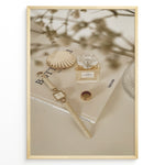 Ladda upp bild till gallerivisning, Fashion Plakat | Chanel No. 5 Perfume Flat Lay with Watch and Books – Neutral Aesthetic Print Plakaty.dk | Flat lay of Chanel No. 5 perfume bottle, gold watch, ring, and decorative shell on fashion books with soft floral blur in neutral tones.
