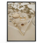 Ladda upp bild till gallerivisning, Fashion Plakat | Chanel No. 5 Perfume Flat Lay with Watch and Books – Neutral Aesthetic Print Plakaty.dk | Flat lay of Chanel No. 5 perfume bottle, gold watch, ring, and decorative shell on fashion books with soft floral blur in neutral tones.
