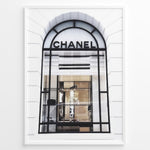 Ladda upp bild till gallerivisning, Fashion Plakat | Chanel Storefront Window – Fashion Photography Print Plakaty.dk | Photograph of a Chanel boutique storefront window with elegant black framing and luxury fashion items on display.
