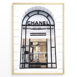 Ladda upp bild till gallerivisning, Fashion Plakat | Chanel Storefront Window – Fashion Photography Print Plakaty.dk | Photograph of a Chanel boutique storefront window with elegant black framing and luxury fashion items on display.
