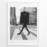 Ladda upp bild till gallerivisning, Fashion Plakat | Chic Chanel Street Style Fashion Print Plakaty.dk | Black and white photo of a stylish woman in heels crossing a city street while carrying a Chanel garment bag, framed as wall art.
