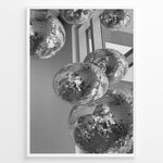 Ladda upp bild till gallerivisning, Fashion Plakat | Cluster of Disco Balls in Natural Light Plakaty.dk | Black and white photo of multiple hanging disco balls reflecting natural light near large windows
