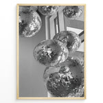Ladda upp bild till gallerivisning, Fashion Plakat | Cluster of Disco Balls in Natural Light Plakaty.dk | Black and white photo of multiple hanging disco balls reflecting natural light near large windows

