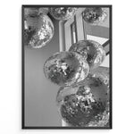Ladda upp bild till gallerivisning, Fashion Plakat | Cluster of Disco Balls in Natural Light Plakaty.dk | Black and white photo of multiple hanging disco balls reflecting natural light near large windows
