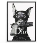 Ladda upp bild till gallerivisning, Fashion Plakat | Dior Guard Dog – Bold Fashion Art Print Plakaty.dk | Black and white image of a Doberman dog holding a handgun in its mouth, wearing a spiked collar with the Dior logo, against a plain background.
