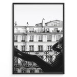 Ladda upp bild till gallerivisning, Fashion Plakat | Elegant Woman Relaxing on Parisian Balcony – Black and White Photography Plakaty.dk | Black and white photo of a woman relaxing on a Parisian balcony with classic building architecture in the background
