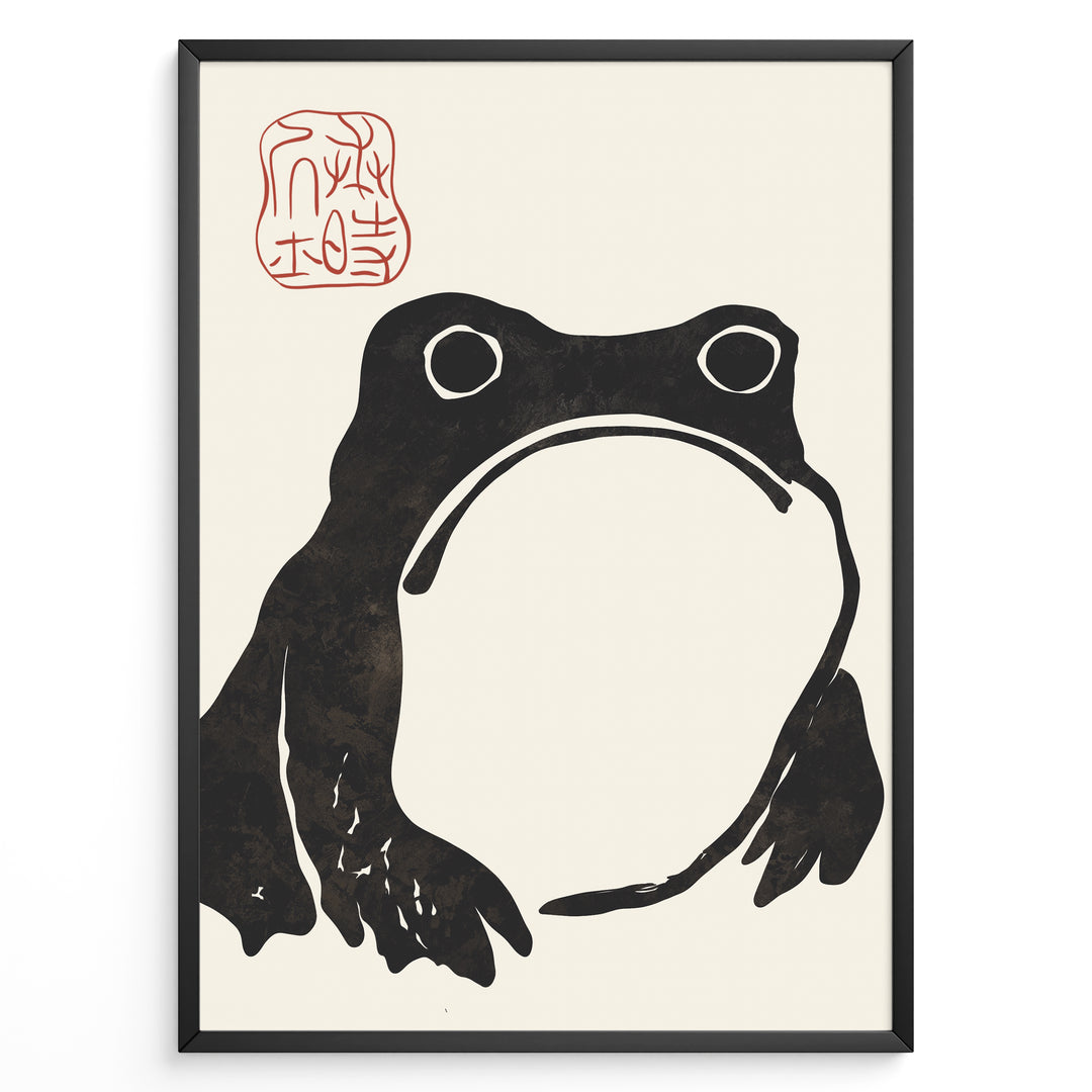 Framed Japanese ink art poster featuring a minimalist black frog illustration with red calligraphy stamp on a beige background.