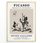 Ladda upp bild till gallerivisning, Framed Picasso Don Quixote art poster with minimalist black sketch of riders and windmills on a beige background.
