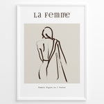 Ladda upp bild till gallerivisning, Framed “La Femme No.1” poster with minimalist brown line art of a woman’s back draped in fabric on a beige background.
