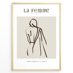 Ladda upp bild till gallerivisning, Framed “La Femme No.1” poster with minimalist brown line art of a woman’s back draped in fabric on a beige background.
