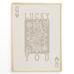 Ladda upp bild till gallerivisning, Framed minimalist “Lucky You” poster featuring Queen of Hearts playing card design in beige tones on a neutral background.
