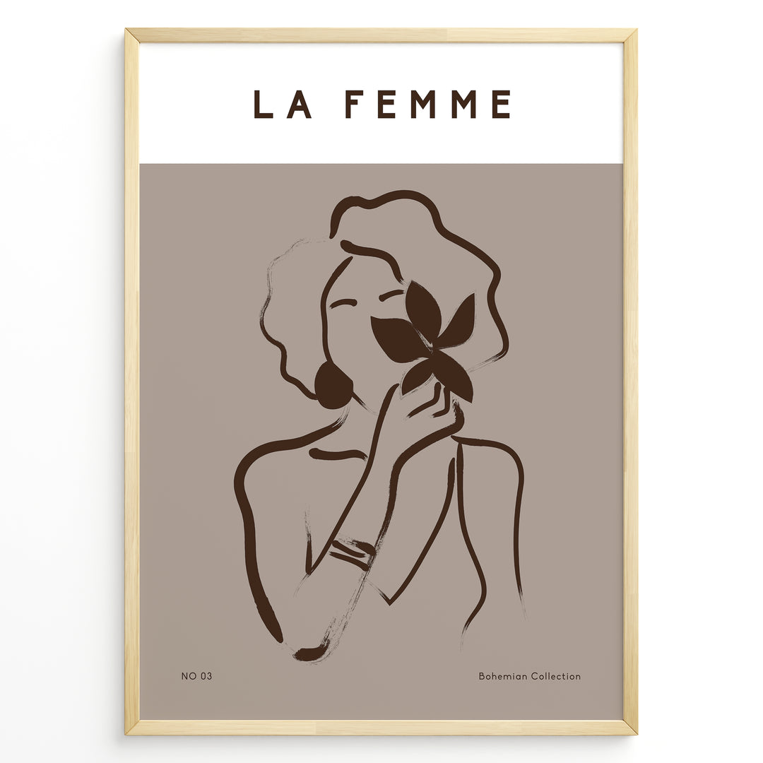 Framed “La Femme No.03” poster with minimalist brown line art of a woman holding a flower on a taupe background from the Bohemian Collection.