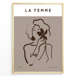 Ladda upp bild till gallerivisning, Framed “La Femme No.03” poster with minimalist brown line art of a woman holding a flower on a taupe background from the Bohemian Collection.
