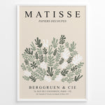 Ladda upp bild till gallerivisning, Framed Matisse-style botanical poster with abstract green and white leaf cutout shapes and beige background, titled “Papiers Découpés.”
