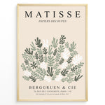 Ladda upp bild till gallerivisning, Framed Matisse-style botanical poster with abstract green and white leaf cutout shapes and beige background, titled “Papiers Découpés.”
