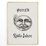 Ladda upp bild till gallerivisning, Framed Duke’s Little Joker vintage poster with detailed moon face illustration smoking a cigarette on a beige textured background.
