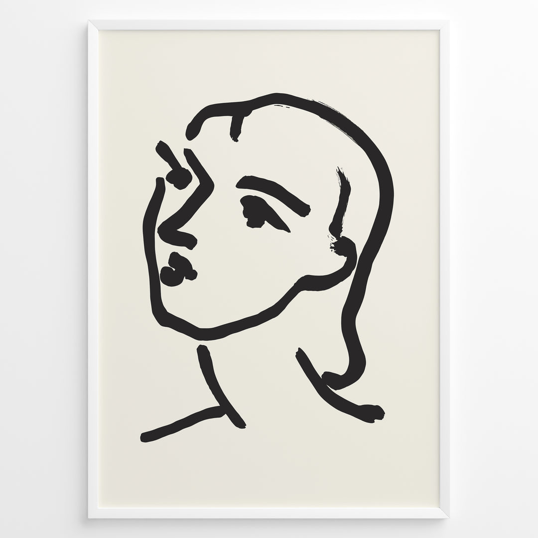 Minimalist black and white abstract face line art print plakat in a modern black frame on cream background.