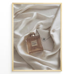 Ladda upp bild till gallerivisning, Fashion Plakat | Gabrielle Chanel Perfume on Silk with Envelope – Luxury Flat Lay Print Plakaty.dk | Gabrielle Chanel Essence perfume bottle and Chanel envelope placed on soft ivory silk fabric in a luxury flat lay composition.
